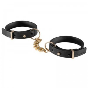 Black faux leather handcuffs with gold-colored chain from the MAZE series by BIJOUX